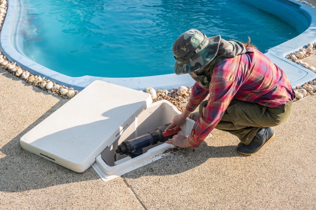 Technician trying to fix swimming pool pumps.